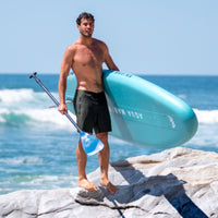Thumbnail for Aqua Marina Beast Paddle Board With A Man Carrying the SUP