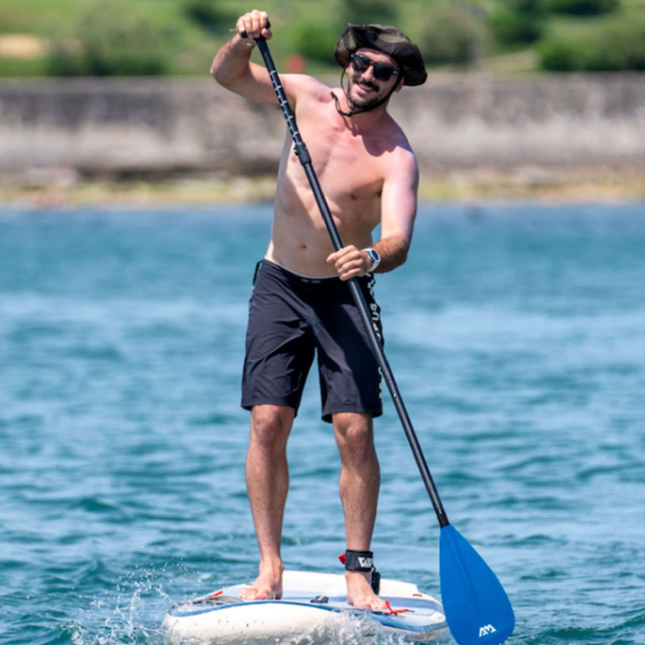 Aqua Marina Magma Paddle Board With A Man Gliding and Paddling