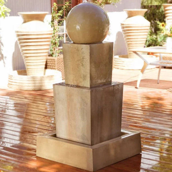 Double Obtuse With Ball Garden Water Fountain By Gist With Table And Planters In The Background