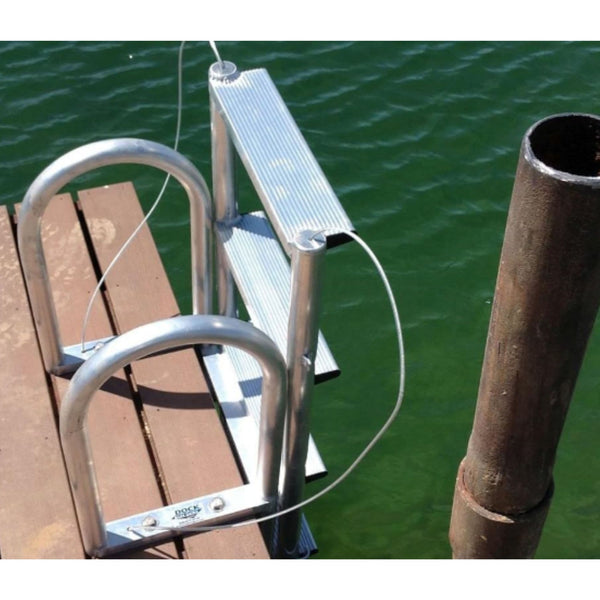 Floating Dock Ladder Close-Up View Attached To Wooden Floating Dock Beside Metal Post