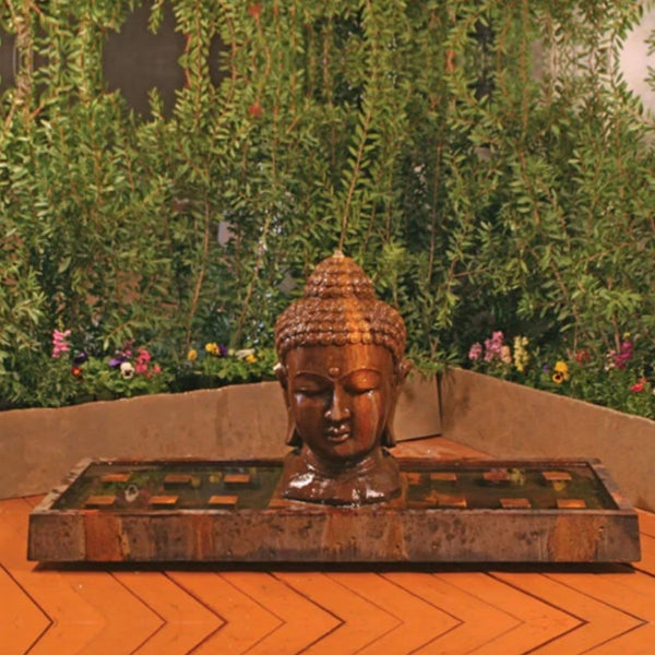Gist Buddha Head Outdoor Fountain - Large With Plants And Flowers Backdrop