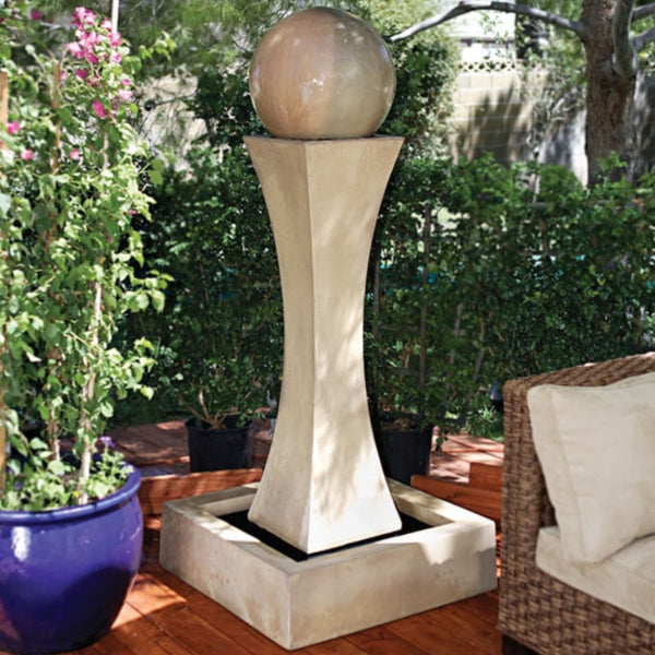 I With Ball Garden Water Fountain By Gist With Rattan Couch And Plants In The Background