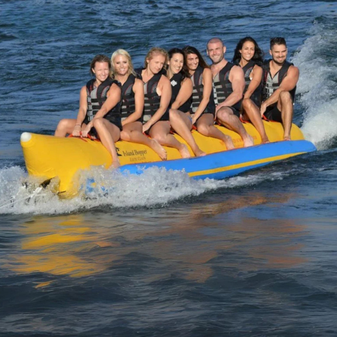 Island Hopper Elite Class 8 Person Banana Boat With Eight People Enjoying The Ride On The Deep Ocean