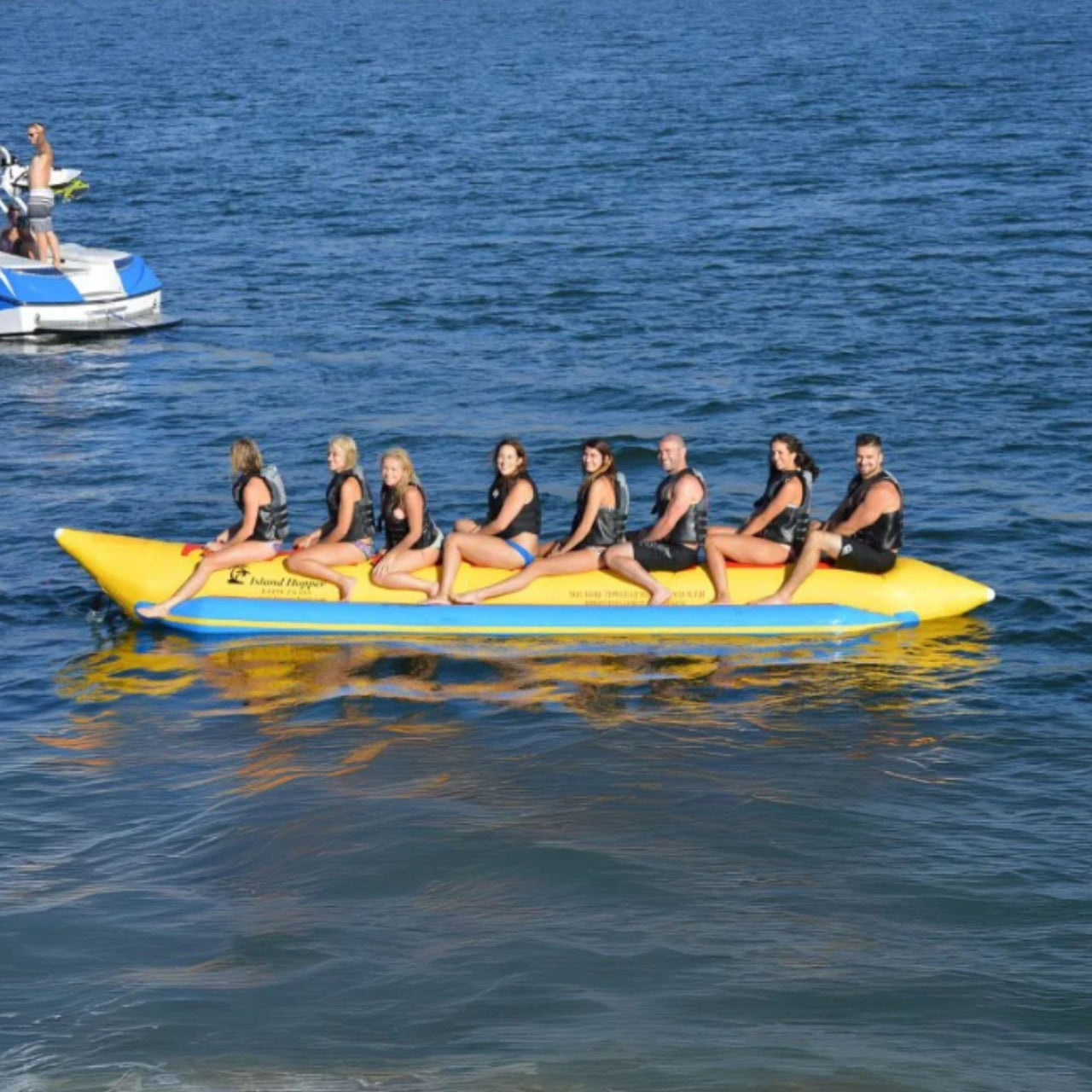 Island Hopper Elite Class 8 Person Banana Boat With Eight Smiling People Ready For Banana Boating