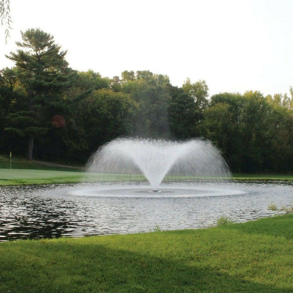 Kasco VFX Series Fountain On The Water With Green Trees In The Background