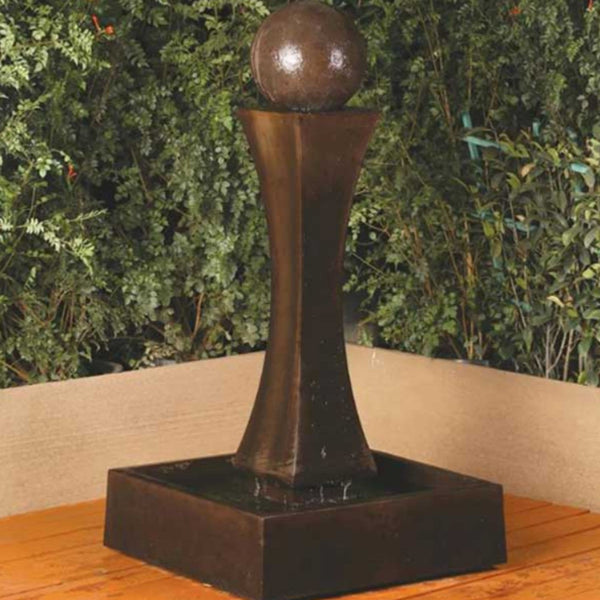 Mini I With Ball Garden Water Fountain By Gist With Green Plants In The Background