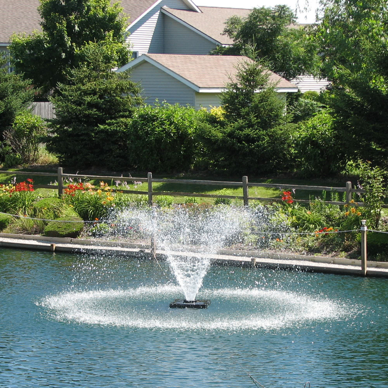 Scott Aerator DA-20 Display Aerator On Water With Houses In The Background