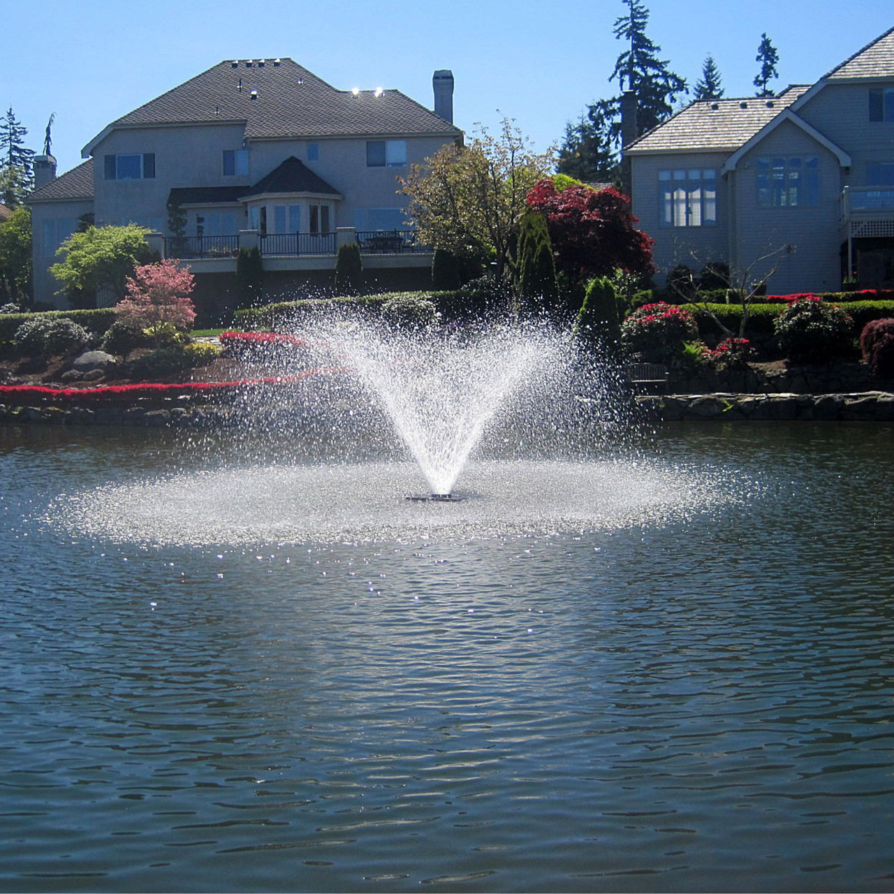 Scott Aerator DA-20 Display Aerator On Water With Two Houses In The Background