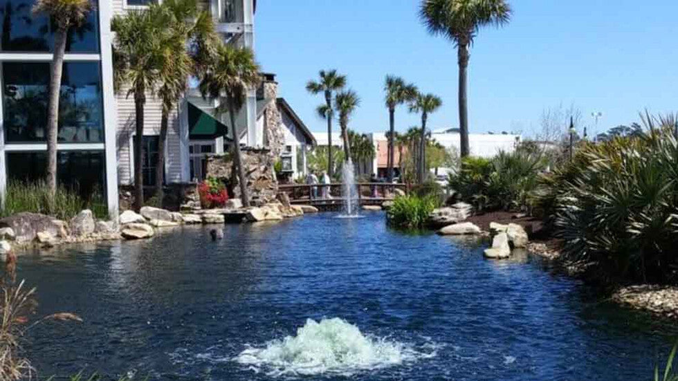 Pond aerator fountain improving water circulation and oxygen levels