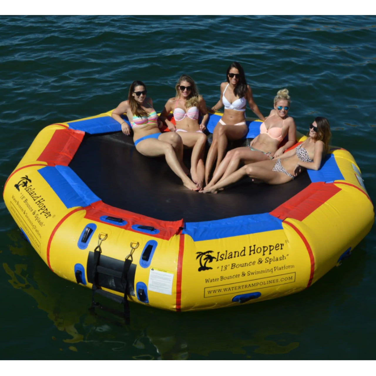 13 Island Hopper Bouncer and Splash With Five Ladies Relaxing While Sunbathing In Calm Water