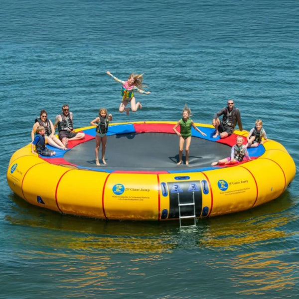25 Island Hopper Water Trampoline Floating On The Blue Calm Blue Waters With Three Adults And Six Kids Are Having Fun