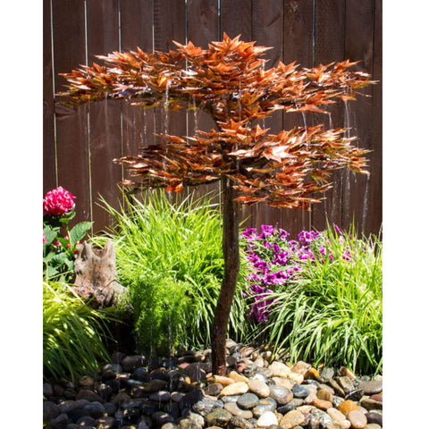38 Copper Japanese Maple Tree Garden Fountain With Wooden Fence In The Back And A Variety Of Plants