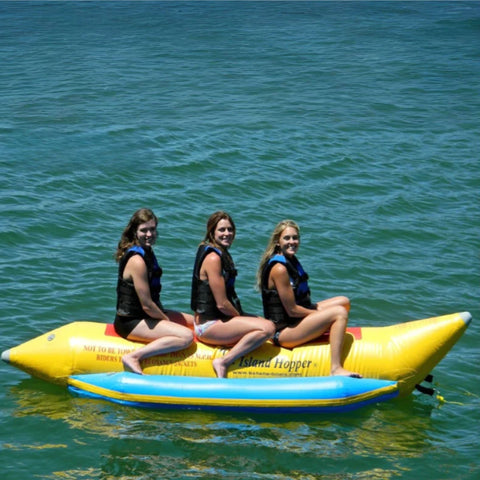 3 Person Inflatable Banana Boat With Three Smiling Girls On A Fun Ride