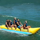 5 Person Inflatable Banana Boat With Five People Laughing While Riding Waves