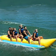 5 Person Inflatable Banana Boat With Five People Laughing While Riding Waves
