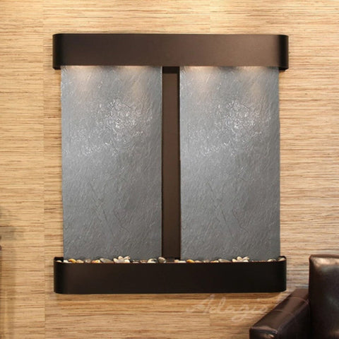 Adagio Aspen Falls Wall Fountain With Leather Brown Chair And Textured Wall Background