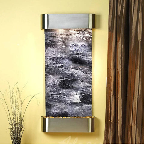 Adagio Cascade Springs Wall Fountain With Yellow Wall Accent And Dried Grass Stems