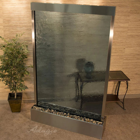 Adagio Grandeur River Floor Water Fountain - Centered in Base With Minimalist Console Table And Potted Tall Plant