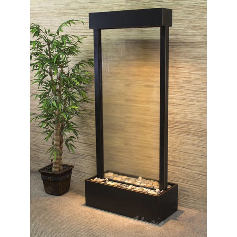 Adagio Harmony River Floor Fountain - Center Mount Besides The Tall Green Plant In The Planter