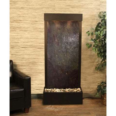 Adagio Harmony River Floor Fountain for Home or Office Decor With Chocolate Brown Leather Chair and Green Plants