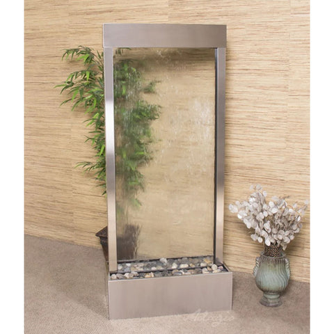 Adagio Harmony River Floor Fountain for Reception or Home Spaces With Artificial Flowers Placed In A Decorative Vase And Tall Potted Plant