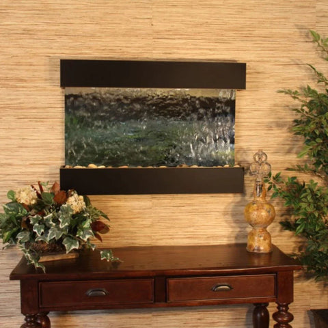 Adagio Reflection Creek Wall Fountain With Small Decorative Jar and Colorful Plants