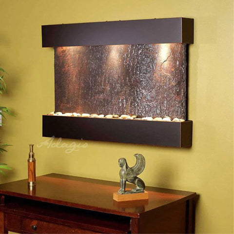Adagio Reflection Creek Wall Fountain With Yellow Paint Wall and a Wooden Sideboard-style Console