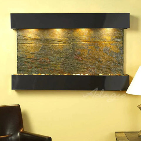 Adagio Sunrise Springs Wall Fountain for Business or Spa Spaces Front View With White Lampshades and a Leather Chair