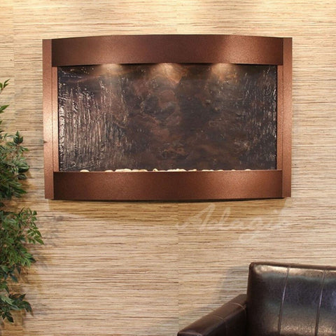 Adagio Water Features Calming Waters Wall Fountain With Green Leaves And Brown Leather Chair