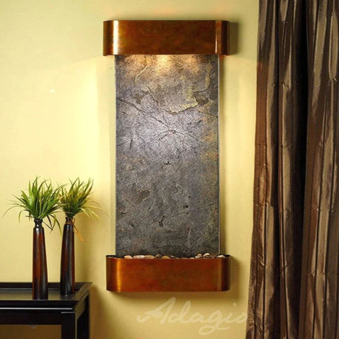 Adagio Water Features Cascade Springs Wall Fountain Tall Brown Vases With Green Grass Plants Placed On The Console Table