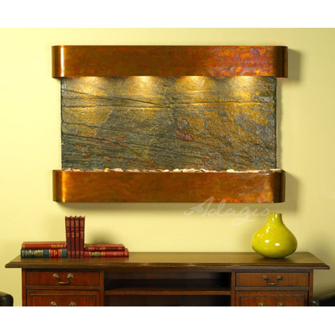 Adagio Water Features Sunrise Springs Wall Fountain With Yellow Accent Wall And Furniture