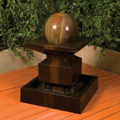 Alaster With Ball Garden Water Fountain By Gist With Green Plants In The Background