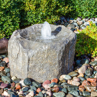 Thumbnail for Alder Falls Rock Outdoor Fountain With  Small Trees In The Back And Surrounded By Stones