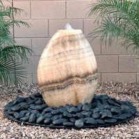 Thumbnail for Almond-Shaped Yellow Onyx Stone Fountain With Brick Wall Background