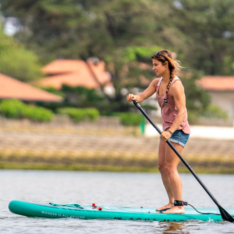 Aqua Marina Breeze Paddle Board On The Water With A Girl Paddling