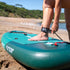 Thumbnail for Aqua Marina Breeze Paddle Board With A Person Attaching The Safety Leash To Their Ankle