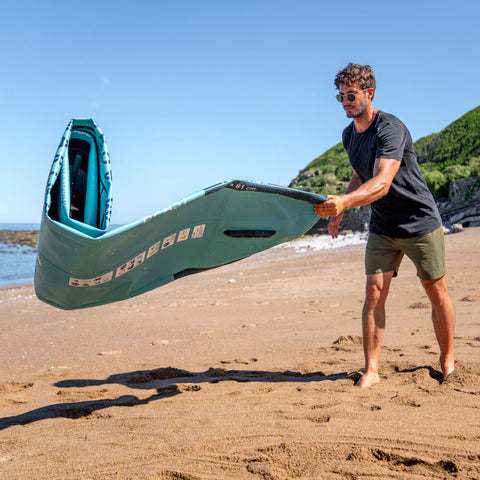 Aqua Marina Breeze With A Man Preparing To Inflate