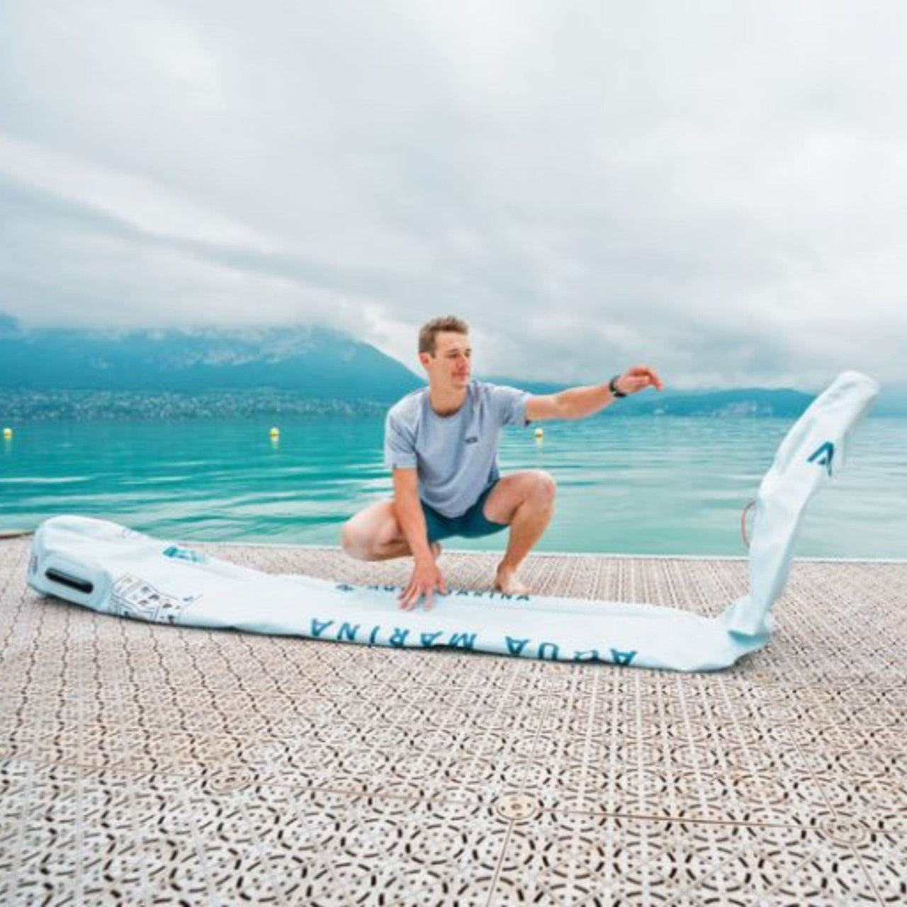 Aqua Marina Airo Lightweight Paddle Board A Man Getting Ready To Inflate The Board