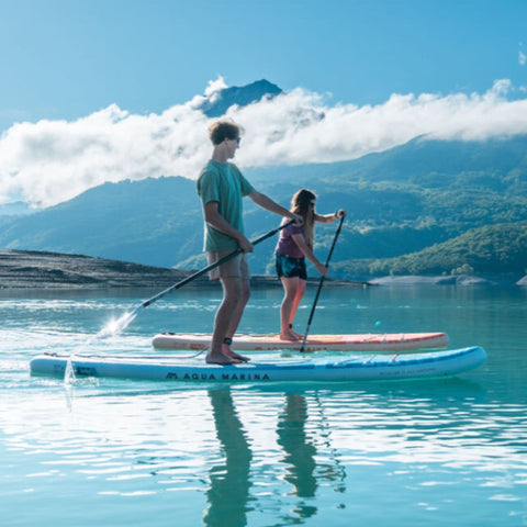 Aqua Marina Airo Paddle Board A Man And A Woman Are Paddling On The Water