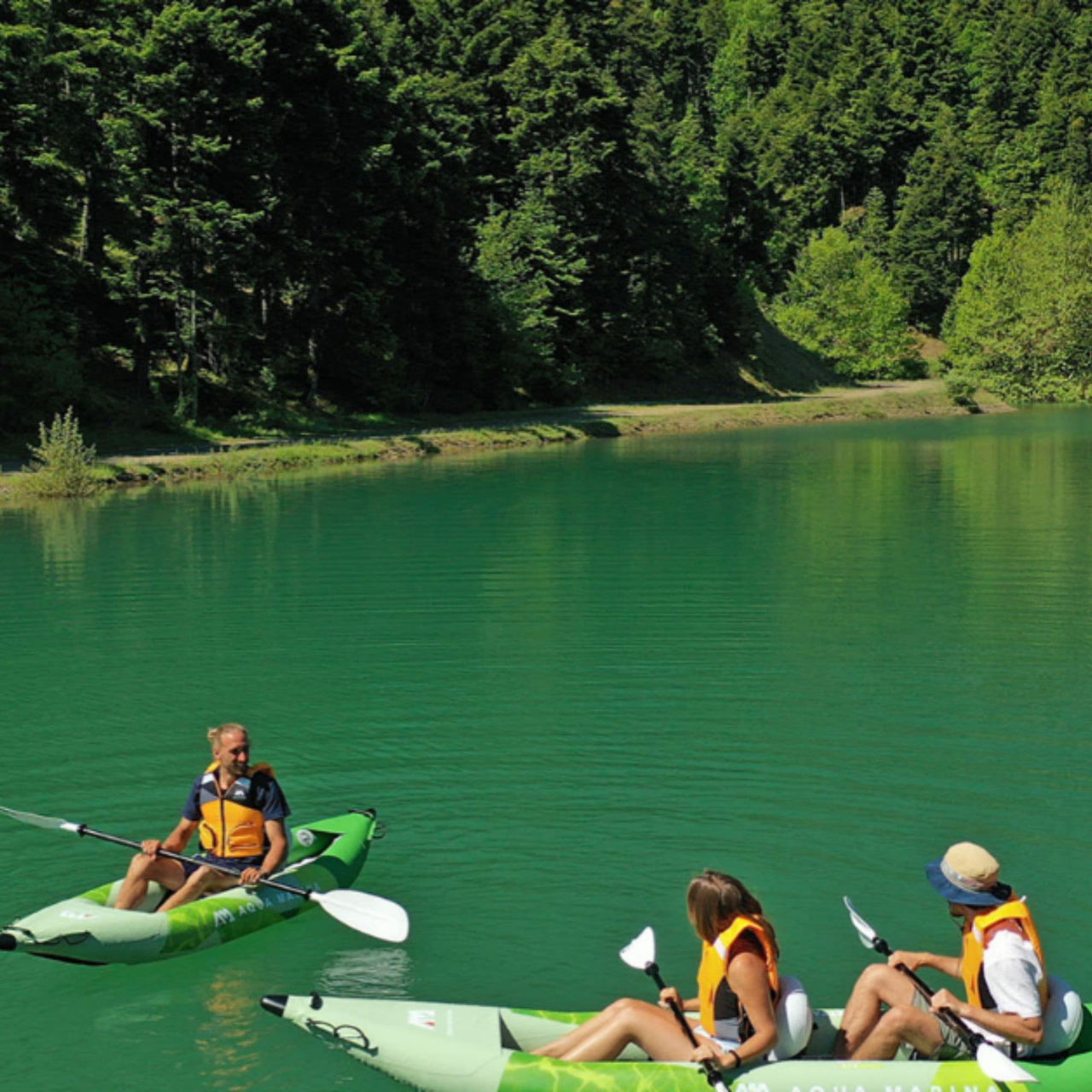 Aqua Marina Betta 412 With A Three People Kayaking On Beautiful Lake