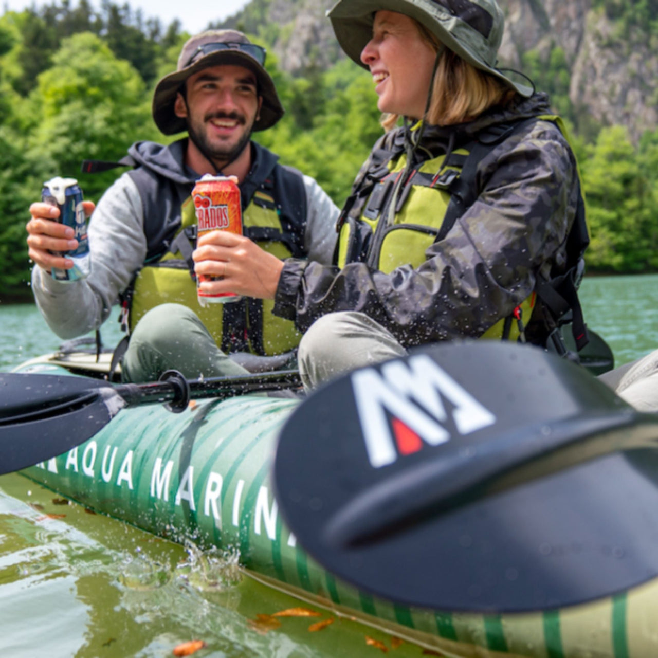Aqua Marina Caliber 13 1 Inflatable Fishing Kayak With A Man And Woman Resting and Drinking From Kayaking