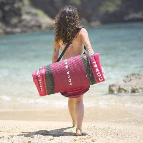 Aqua Marina Coral 10 2 Rolled Up With A Girl Carrying It On Her Back