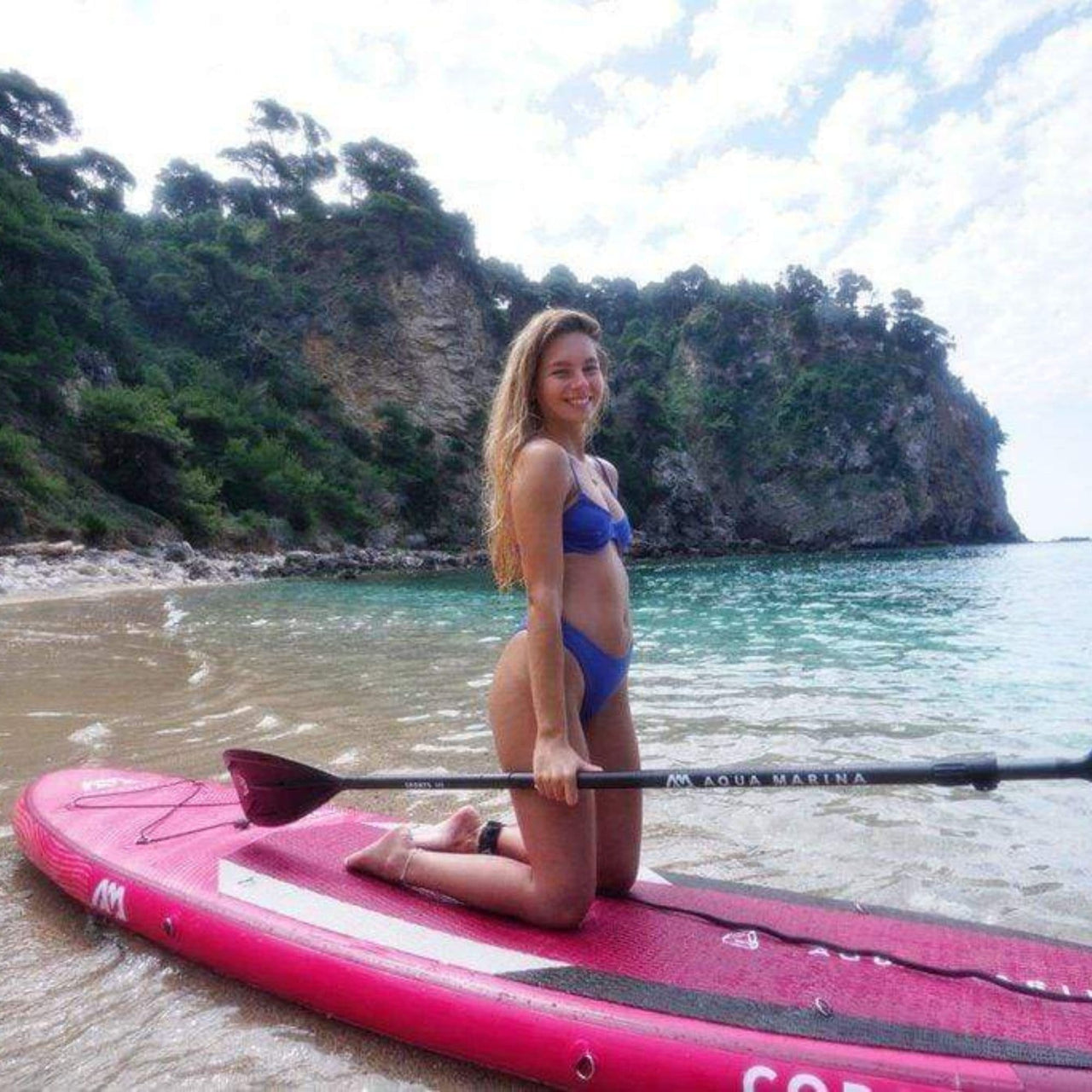 Aqua Marina Coral Paddle Board with Excited & Smiling Girl