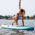 Thumbnail for Aqua Marina Dhyana Yoga Paddle Board With A Woman Doing Yoga On Board Over Water