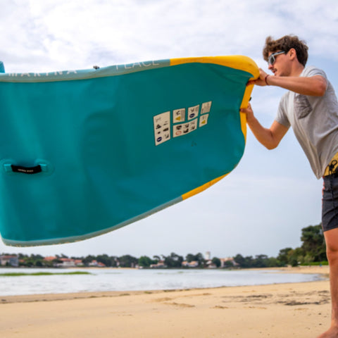 Aqua Marina Fitness Mat With A Man Unfolding And Getting Ready