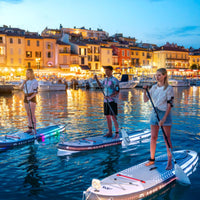 Thumbnail for Aqua Marina Glow Board With A Man And Two Women Enjoying The View While Paddling