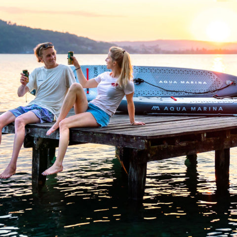 Aqua Marina Glow Board With A Man And Woman Setting And Drinking