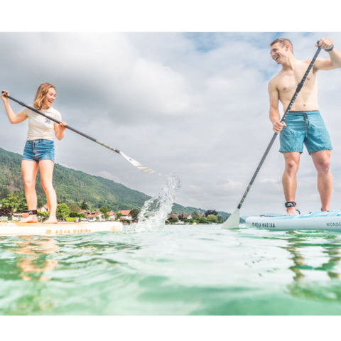 Aqua Marina Halo Paddle Board A Man And A Woman Are Playing While Paddling