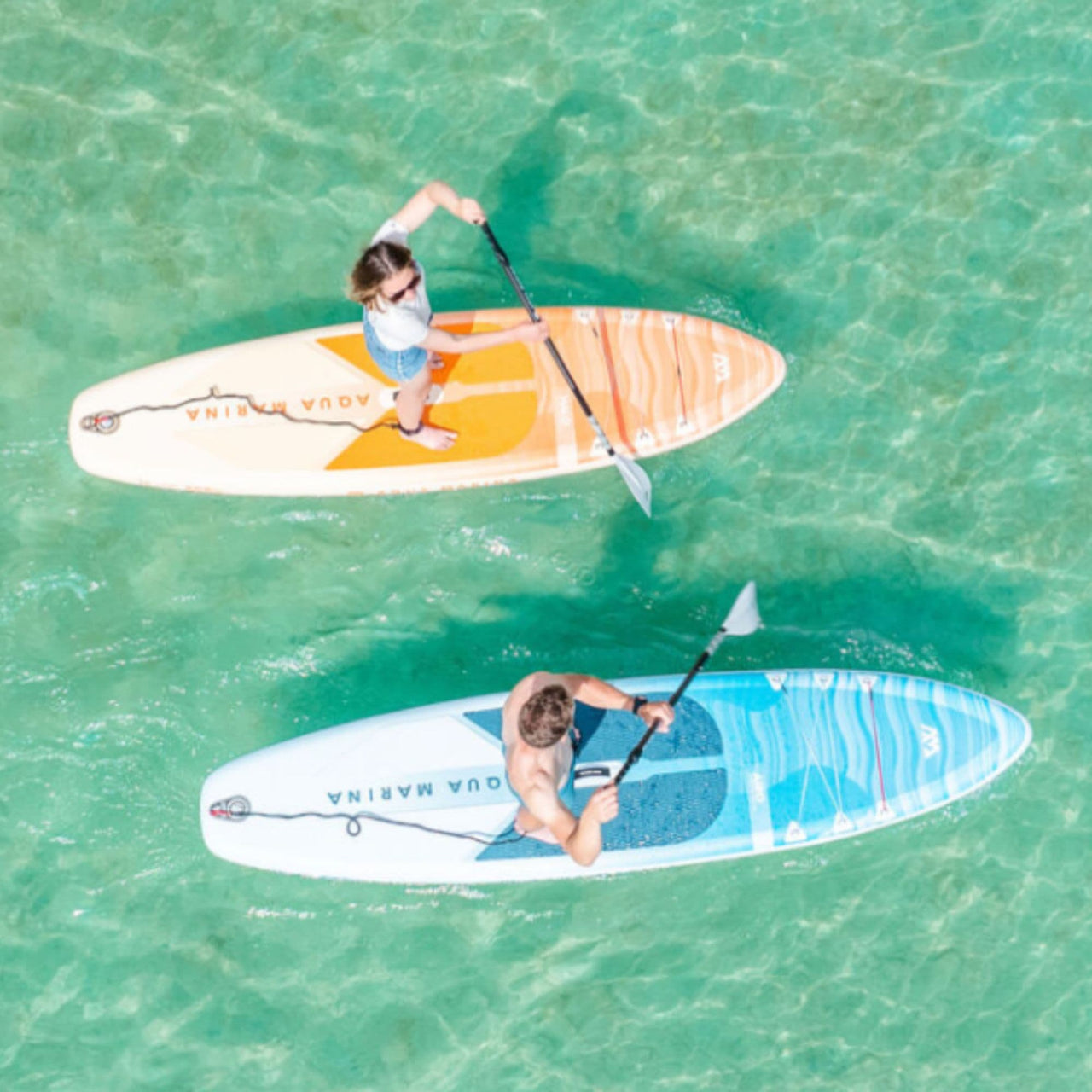 Aqua Marina Halo SUP A Man And A Woman Paddling In The Water