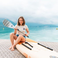 Thumbnail for Aqua Marina Halo SUP Girl Sitting On Board At The Sea